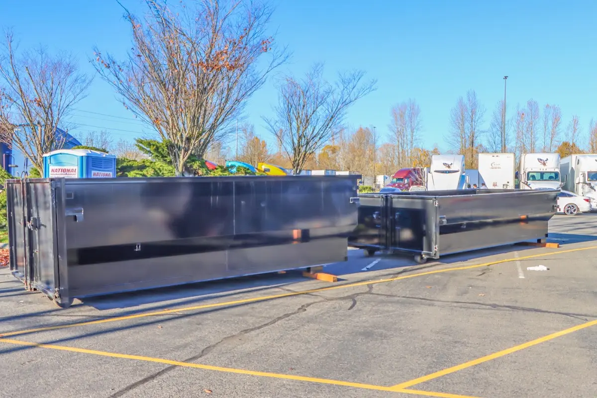 Professional dumpster rental service with roll-off container on residential driveway in Harker Heights